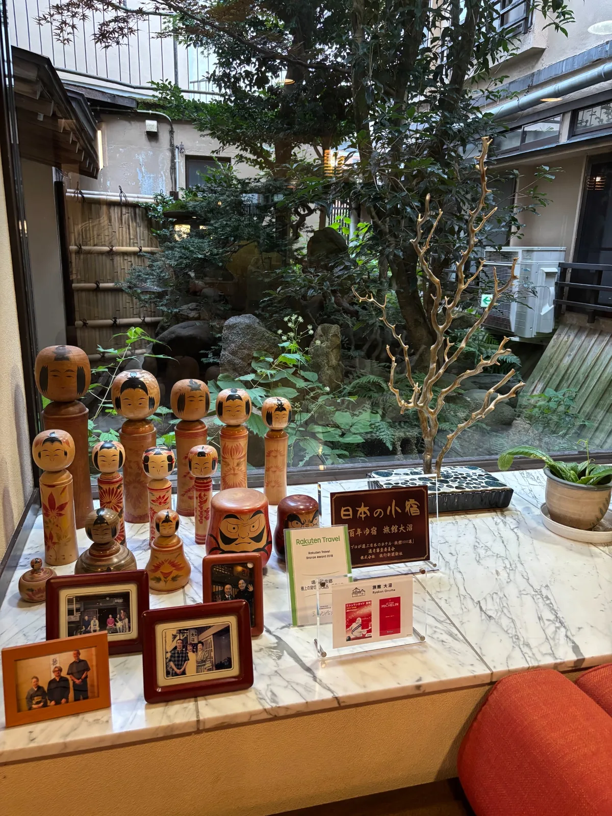 Kokeshi dolls and a small garden inside Ryokan Onuma