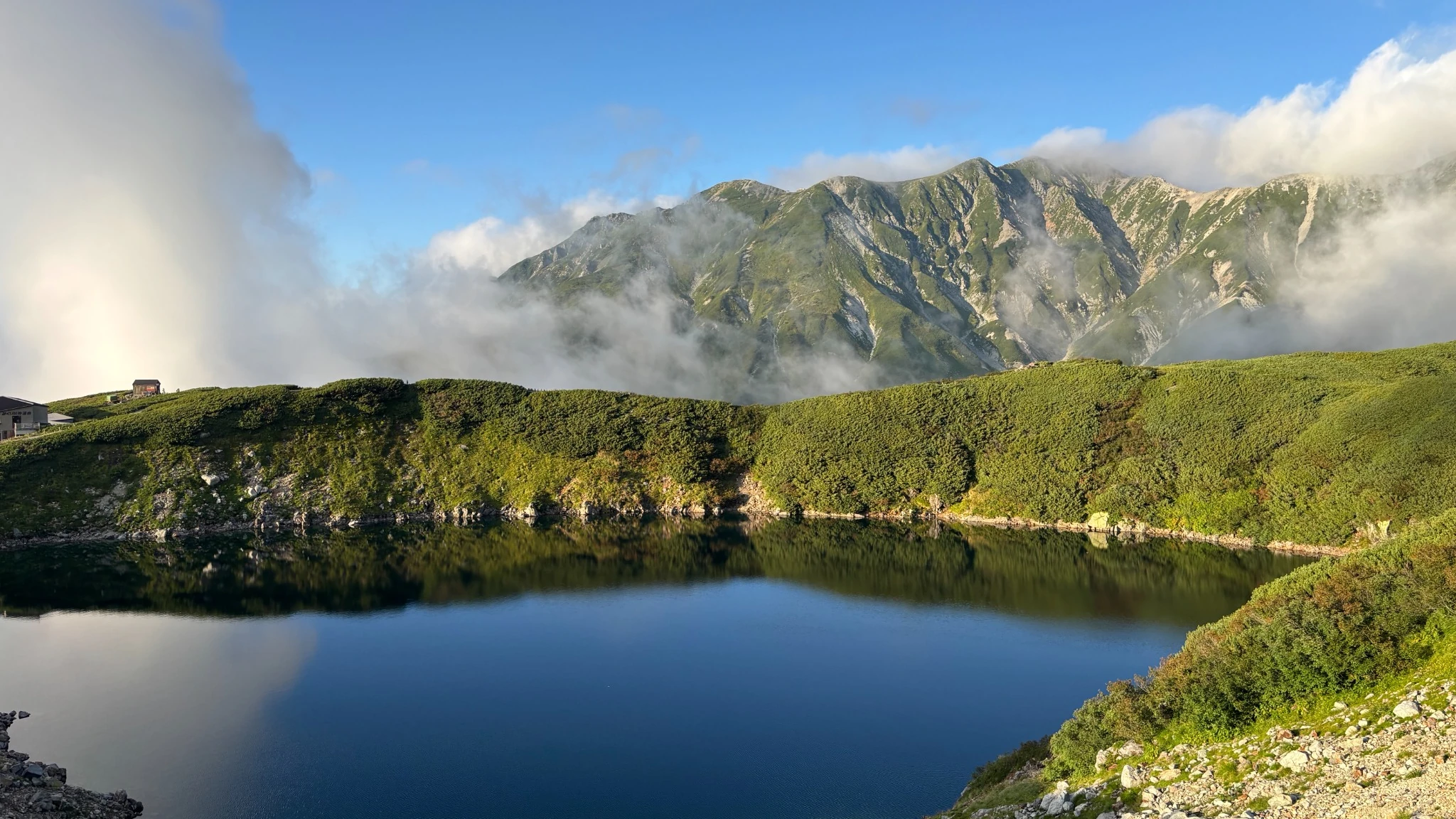 Mikurigaike Pond beneath the mountains of Tateyama in clear morning light